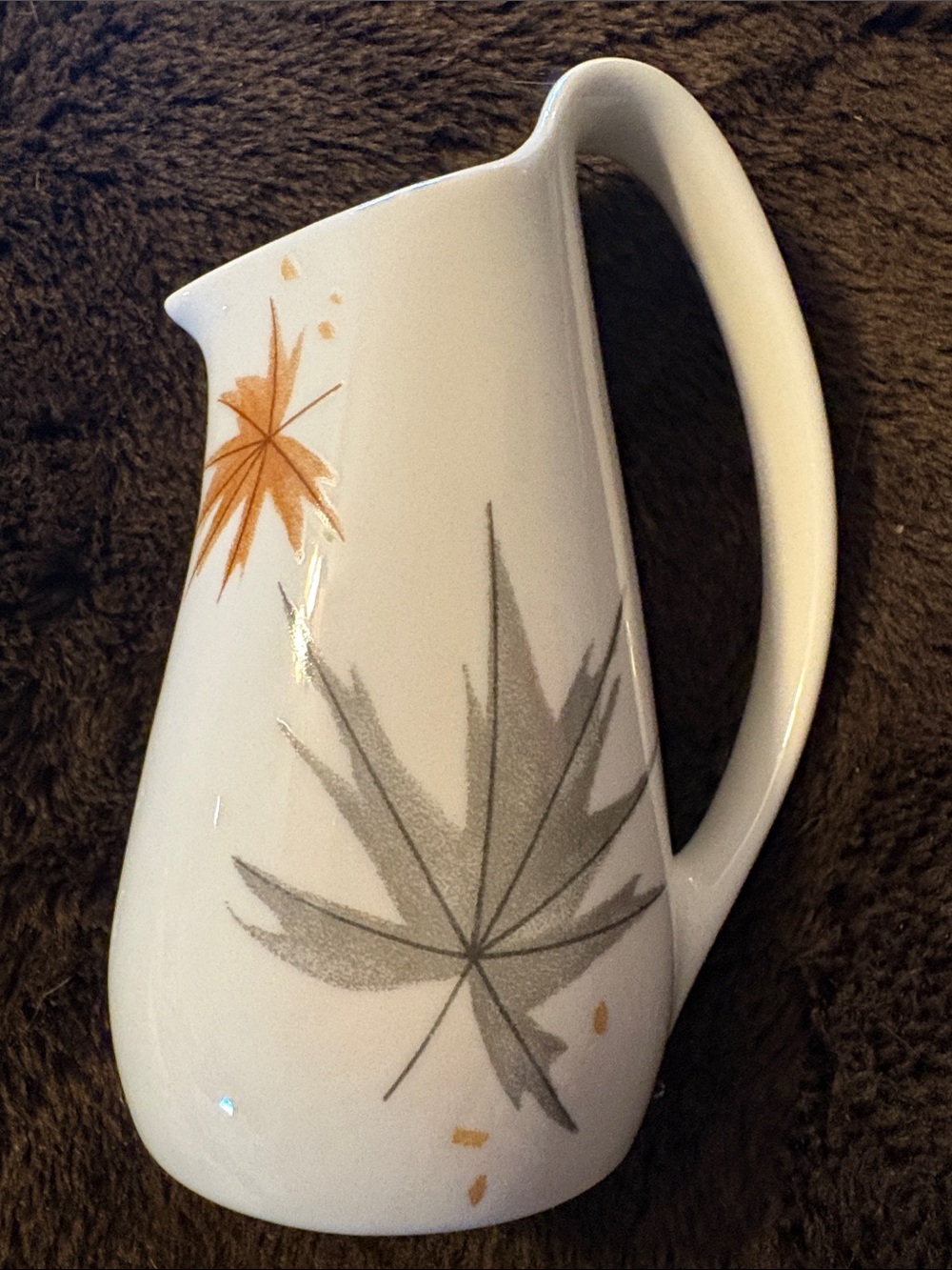 White Ceramic Pitcher with Gray and Orange Leaf Motif